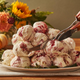 Turkey Cranberry ice cream being carved up like a Thanksgiving turkey
